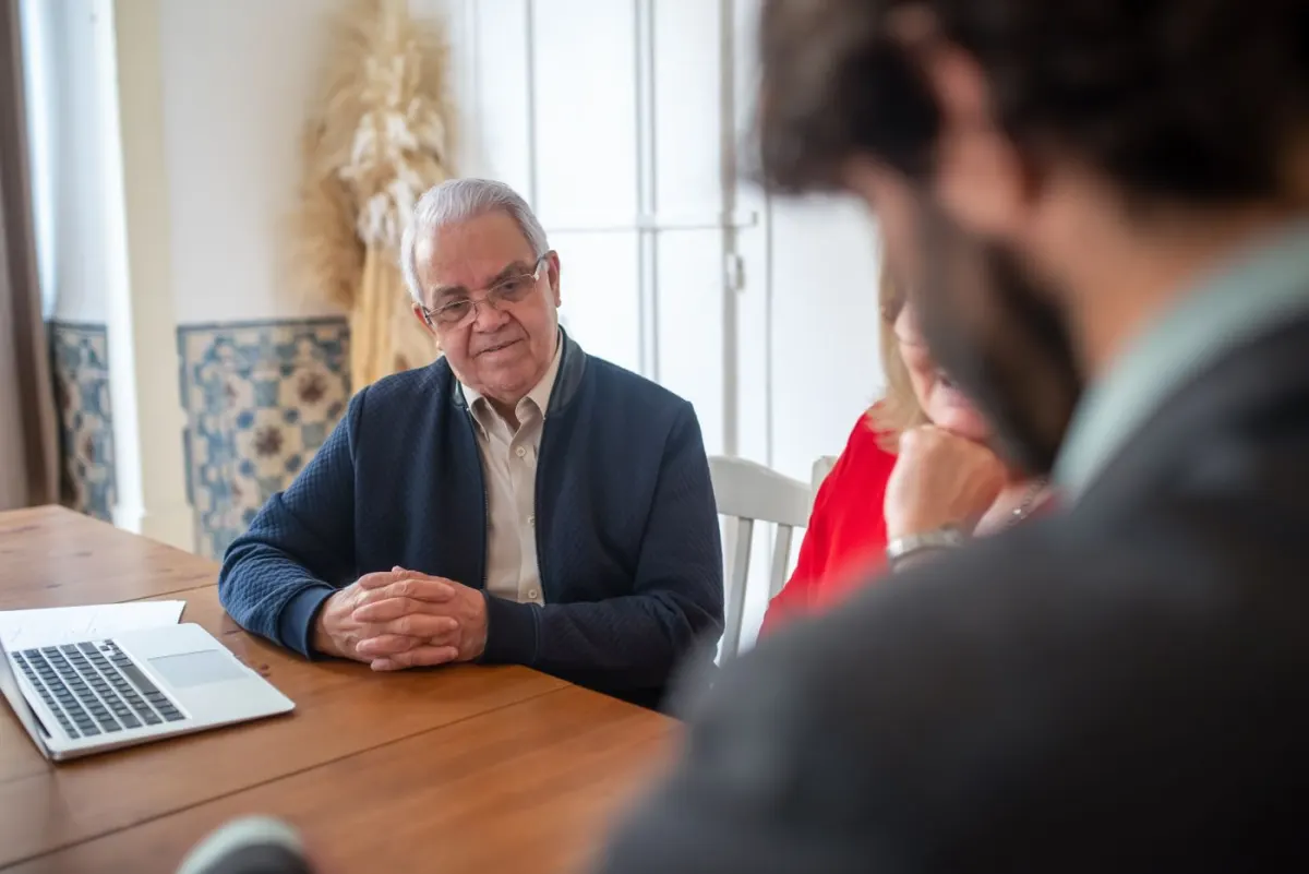 Client and advisers discussing information at an office meeting